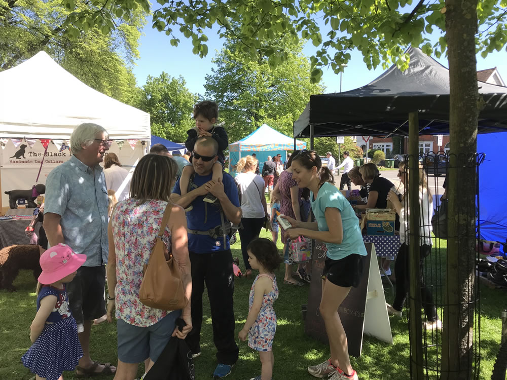 Families enjoy the Community Event in Weybridge on Monument Green